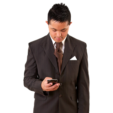 A man in a suit looks down at his mobile phone