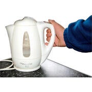 A hand on an electric kettle.
