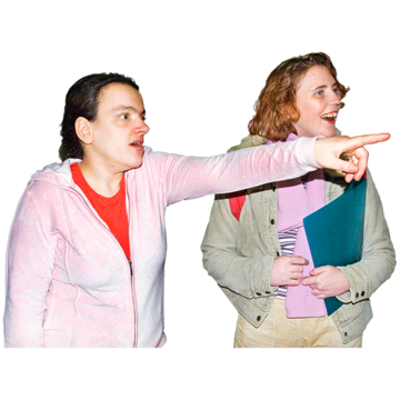 A young woman pointing to show another woman something