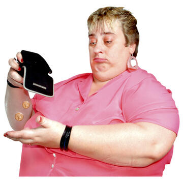 A lady looking sad and holding her wallet upside down with a couple of coins falling out.