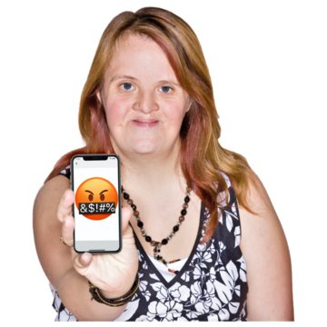 A woman holds up the screen of her mobile phone to show a nasty message she has received