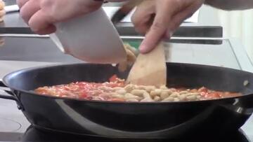 A bowl above a frying pan.