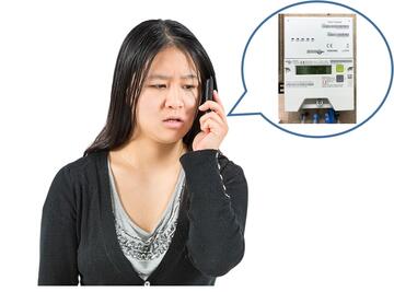 A lady talking on the phone.  In the speech bubble is a smart meter.