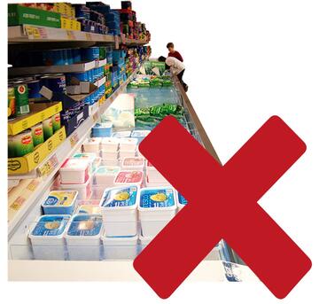 A red cross beside a supermarket aisle with a freezer and tins of food.