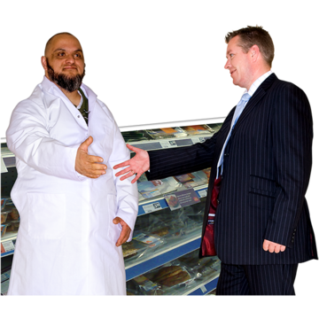 A grocer in a supermarket is shaking the hand of a man in a suit