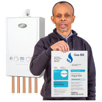 A man standing in front of a gas boiler holding a gas bill