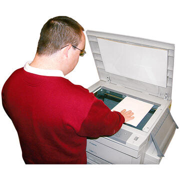 A man using a photocopier.