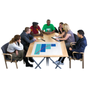 A group of people talking around a meeting table