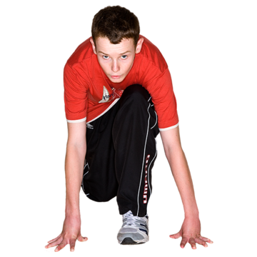 A young man in a running starting position