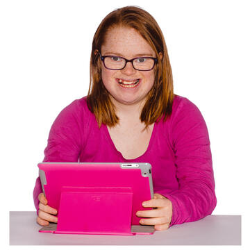A girl sitting at a table with an ipad.