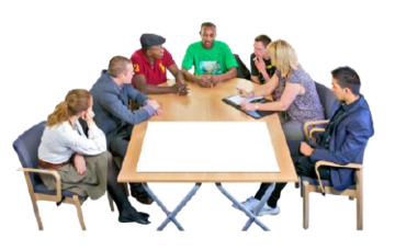 A group of people are sat around a table talking