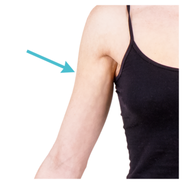 A close up of a woman's arm with a blue arrow pointing at it