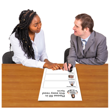 A woman helping a man to fill in a form