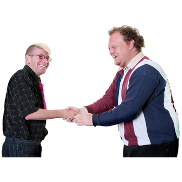 A man shaking hands with another man. Both are smiling.