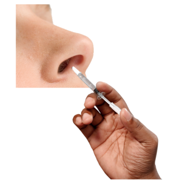 A vaccine spray being put up someone's nose