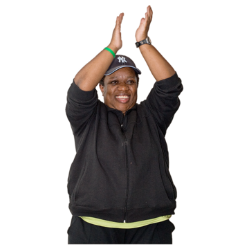 A woman clapping her hands above her head