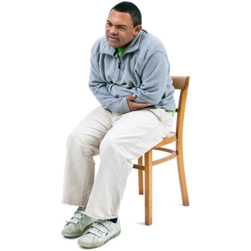 A man holds his stomach in pain