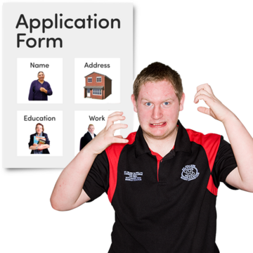 A frustrated man holding his hands up in front of an application form