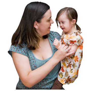 A woman holding a small girl who has Downs syndrome