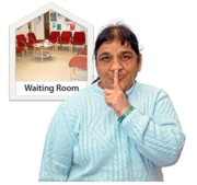 A woman holding her finger to her lips next to a photograph of a waiting room