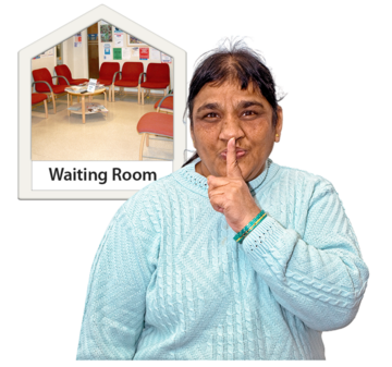 A woman holding her finger to her lips next to a photograph of a waiting room