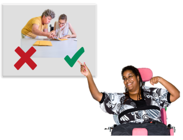 A poster with a red cross and a green tick underneath a picture of a woman putting letters in envelopes with help from another person. A woman in a wheelchair next to the poster is pointing to the green tick