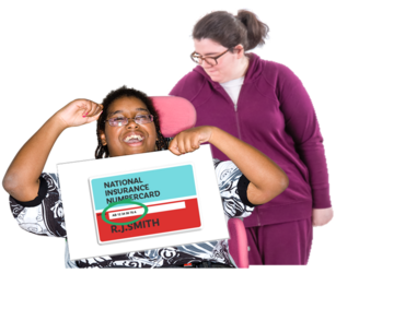A carer has her arm around a woman in a wheelchair who is holding up a sign which shows a national insurance card number
