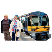 Two people standing next to a train, about to take a journey.