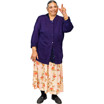 An Asian woman smiles and points up