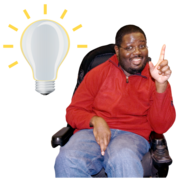 A man in a wheelchair has his finger in the air with a picture of a light bulb next to him