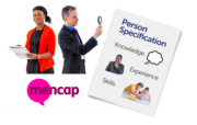 A couple of people in suits above the Mencap logo. One person has a magnifying glass looking towards a CV (person specification form)