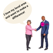 A man working for Mencap shakes hands with a woman who is talking about how much she cares about her local area.