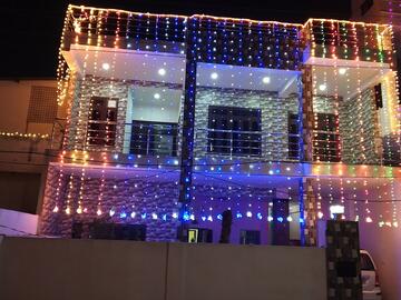 A house with decorative lights hanging down the front