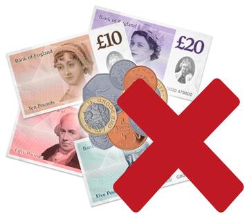 A pile of money with a red cross beside it.
