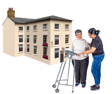 A woman being helped to use a walking frame outside a large home