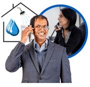 Two people talking on the phone with a house and water drops and a shower behind them.