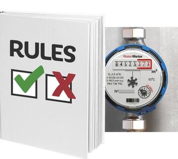 A water meter beside a book of rules.