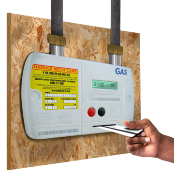 A gas meter with a hand inserting a card into it