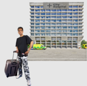 A man with a wheelie suitcase in front of a hospital building