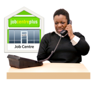 A woman at a desk is talking on the phone. Behind her is a picture of a Jobcentre Plus office