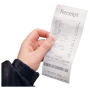 A hand holding a shopping receipt