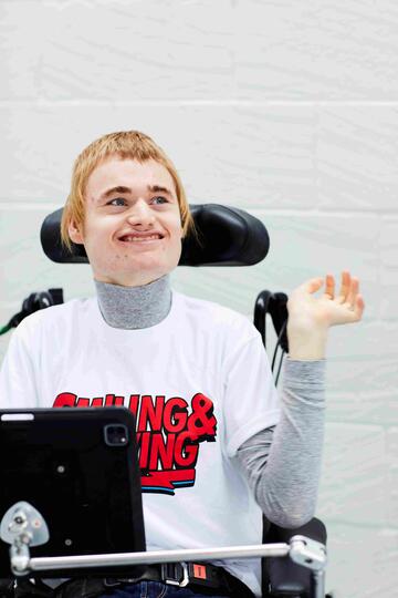 A photograph of Alistair in his wheelchair.