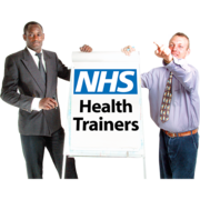 Two people either side of a flipchart which says NHS Health Trainers