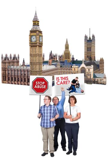 protestors with signs to stop abuse outside the Houses of Parliament