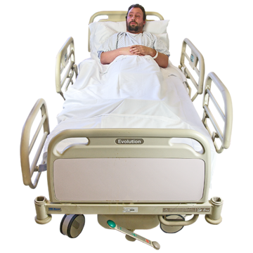 A man laying in a hospital bed.