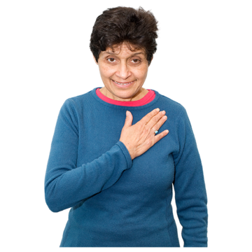 A woman with short dark hair wearing a blue jumper holds her palm on her chest