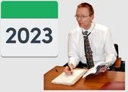Doctor at a desk with a 2023 calendar