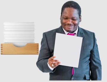 A man reading a letter in front of an tray full of other letters
