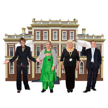 A group of people standing in front of a building.