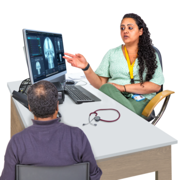 A doctor is talking to a patient showing him his x ray and explaining things to him